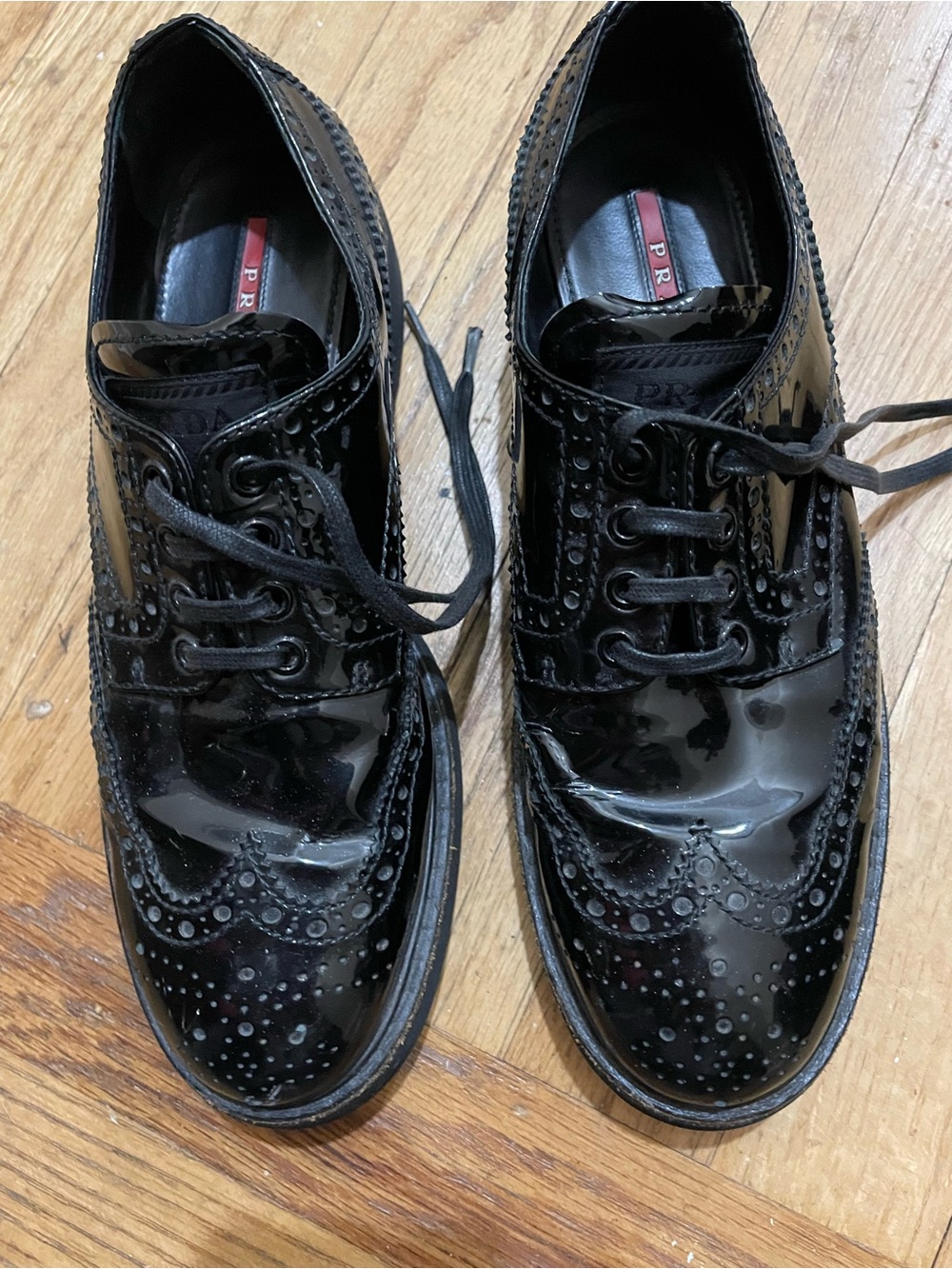 Prada Black Patent Leather Brogue Lace-Up Oxfords with Red Inlay